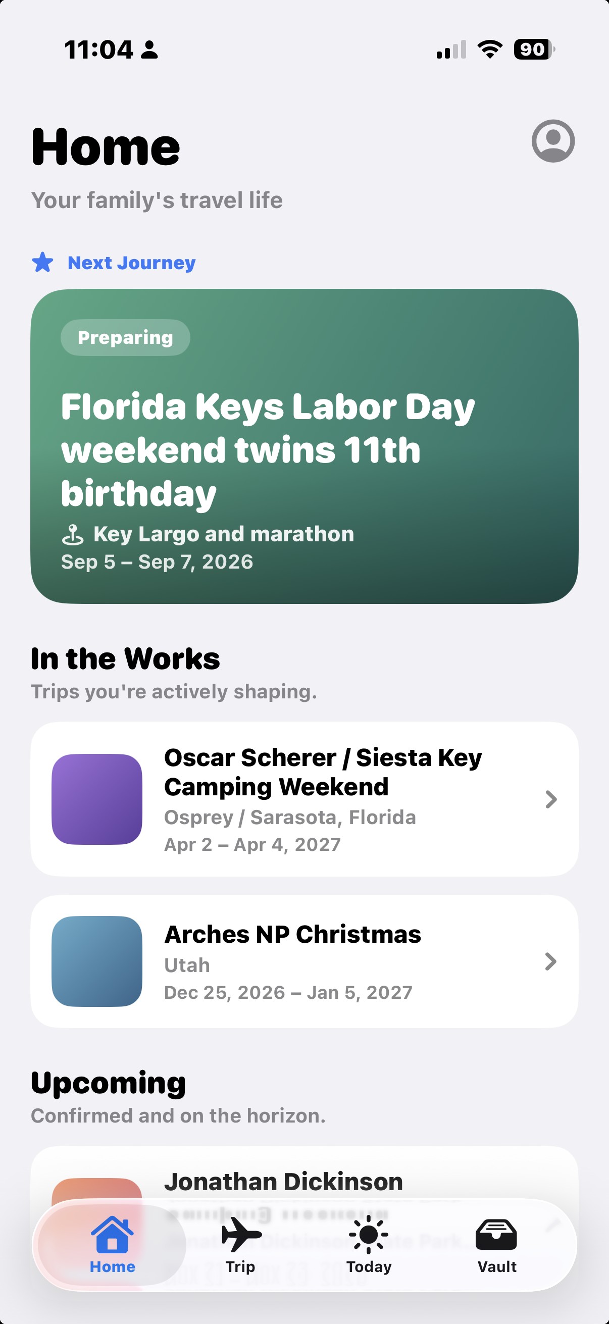 Home screen showing a family's trips grouped as Next Journey, In the Works, and Upcoming.